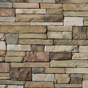 Manufactured faux stone veneer for exterior or interior wall cladding