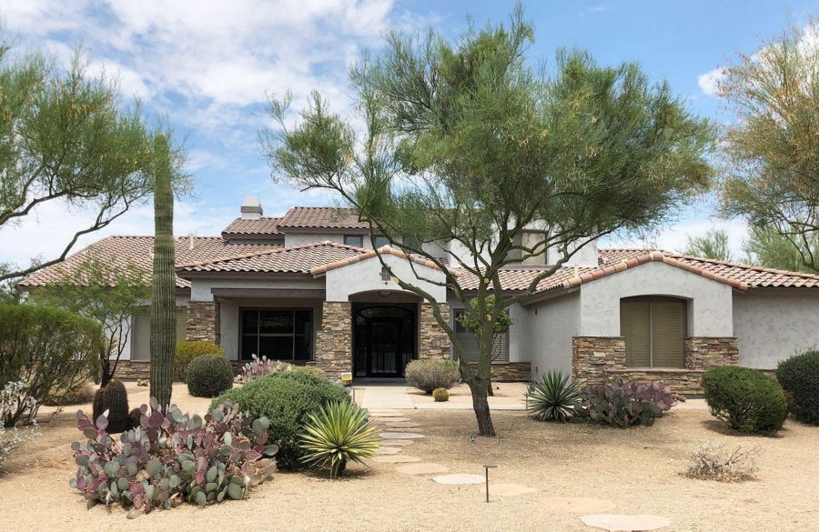 A Scottsdale home in the Phoenix East Valley featuring a manufactured stone veneer siding with a warm, earthy blend of tans and browns that enhances the desert landscaping and property value.